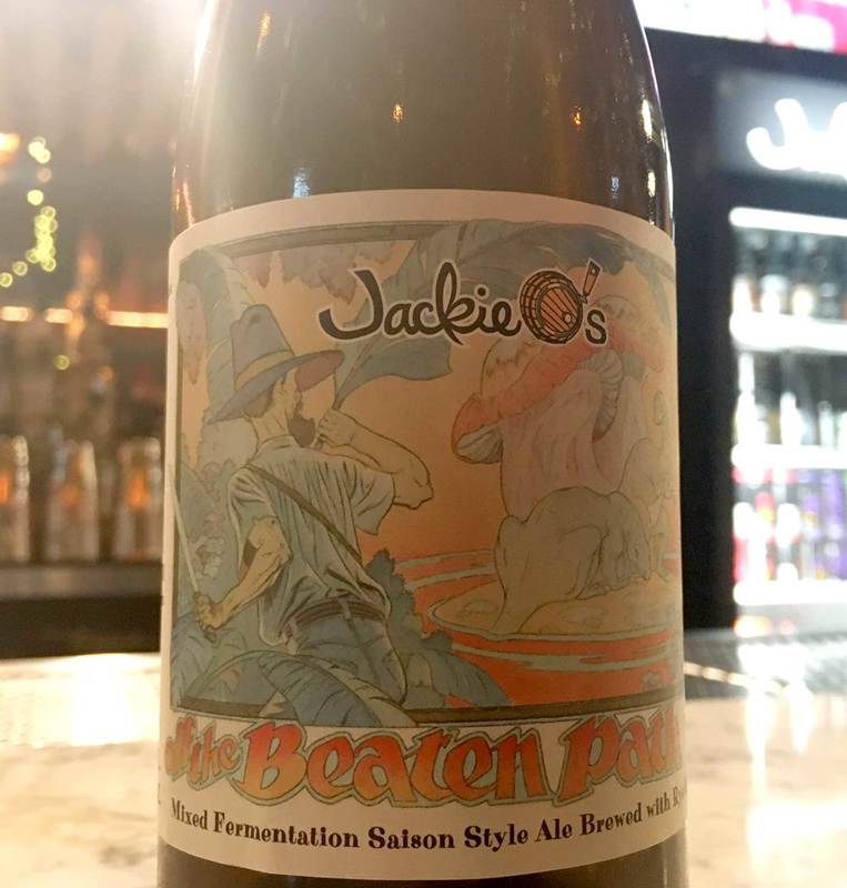 bottle of Jackie O's beer with artwork by Sandy Plunkett on the label